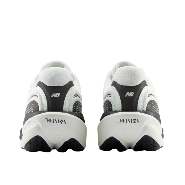 Two mint/black New Balance Women's 1080V15 running shoes viewed from the back, INFINION on cushioned heels.