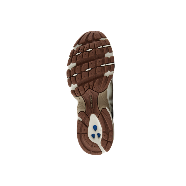 Brown and white sole of NEW BALANCE U530cob men's shoes, with black and blue accents, on a white background.