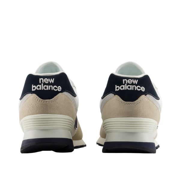 NEW BALANCE U574 Sea Salt/Linen unisex sneakers with beige suede and navy accents; New Balance logo on heel.