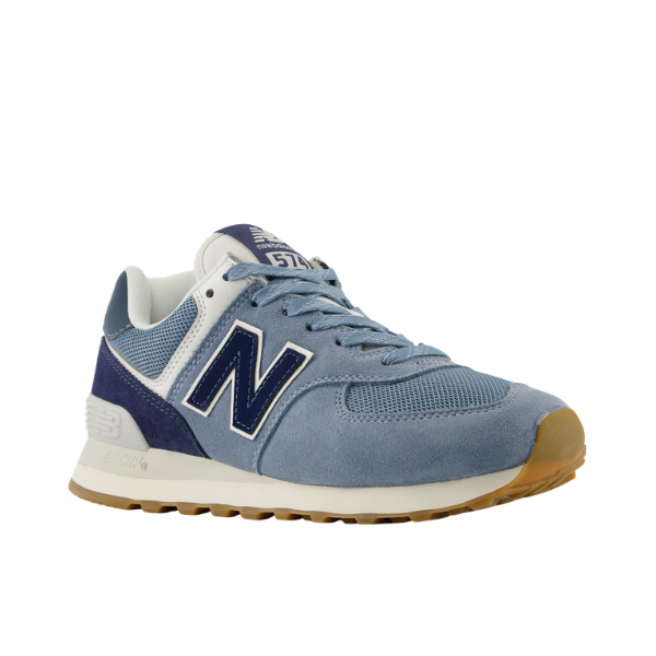 NEW BALANCE Women's 574 sneakers in blue/white with dark blue accents and tan outsole on a white background.