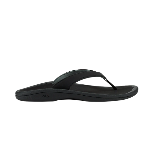 OLUKAI Women’s Ohana Lahi White Sand/Black sandal with contoured footbed, side view on white background.