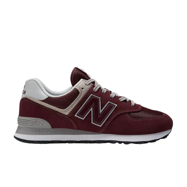 The NEW BALANCE Mens 574 Magenta sneaker features maroon and gray colors with white accents, gray laces, and a large N logo. Shown in side profile on a white background—ideal for running and designed to help reduce foot pain.