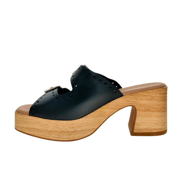 The Sovella Womens Paola Black by SOVELLA is a black leather open-toe mule sandal featuring decorative cutouts, a thick light wooden platform sole, chunky curved heel, and padded footbed for all-day comfort.