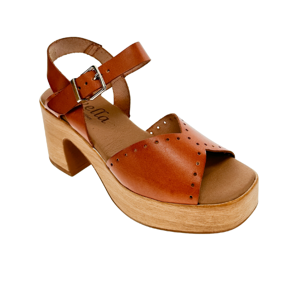 The SOVELLA Womens Lucia Tan sandal features a brown leather upper with ankle strap and buckle, open toe, wooden platform sole, chunky heel, decorative perforations, and a supportive footbed for all-day comfort.