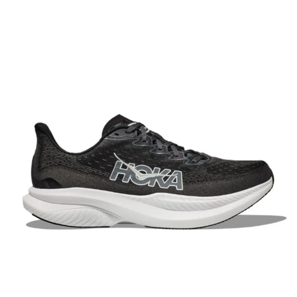 The HOKA Mens Mach 6 (Wide Width) in Black/White features a black upper, white sole, and white HOKA logo on the side. Set against a plain white background, its ideal for everyday runners seeking speed.