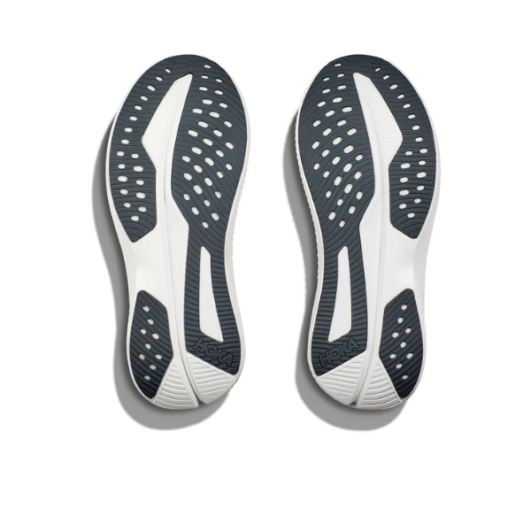 A pair of HOKA Womens Mach 6 (Wide Width) Vanilla running shoe soles, shown from below with oval cutouts and textured grip—perfect for Wide feet or plantar fasciitis relief—displayed on a plain white background.
