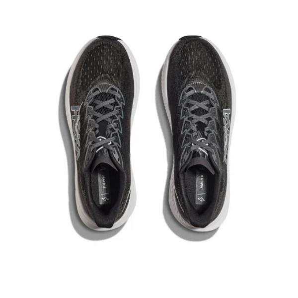 A pair of HOKA Mens Mach 6 (Wide Width) running shoes in black/white, designed for speed and daily runs, shown from above on a white background with the HOKA logo visible on each side.