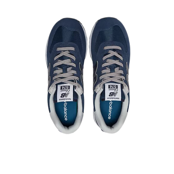 A pair of NEW BALANCE Mens 574 Navy running shoes with gray laces, shown from above on a white background. Designed for comfort and style, these sneakers feature the iconic logo on the tongue and sides.