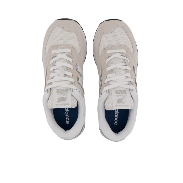 Top view of New Balance Womens 574 Core sneakers in white and grey, featuring mesh toe boxes, white laces, and dark blue insoles. A versatile NEW BALANCE shoe displayed on a plain white background.