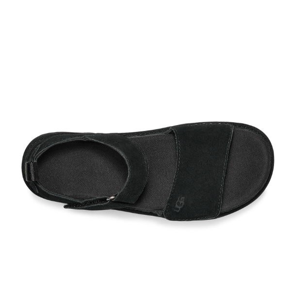 Top view of the UGG Womens Goldenstar Sandal in black, featuring an open toe, Wide front strap with UGG logo, ankle strap with buckle, suede-like finish, and a SugarSole EVA sole for added comfort.