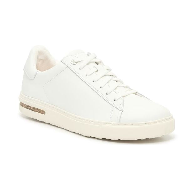 The BIRKENSTOCK Womens Bend White Leather is a minimalist white low-top sneaker with white laces, a textured sole, a tan side accent on the heel, and a contoured footbed inspired by Birkenstock support for comfort.
