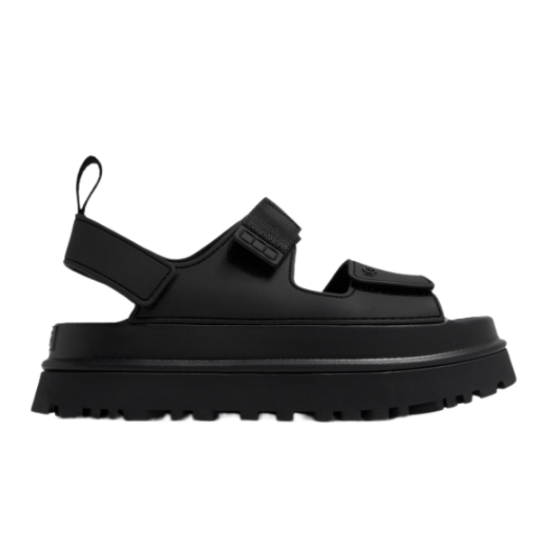 The UGG Womens Goldenglow Sandals Black feature a chunky, ridged platform sole, open toe, and three adjustable straps—ideal for fans of stylish UGG sandals.
