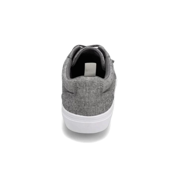 A Rival Womens Tilt Grey Chambray sneaker by RIVAL, INC., featuring a white abrasion-resistant rubber outsole, is shown from the back against a plain white background.