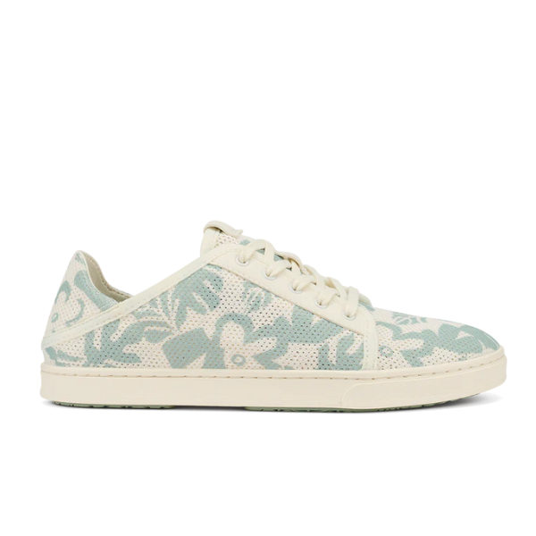 The Olukai Womens Pehuea Li Sneakers Offwhite by OLUKAI feature a floral-patterned upper in soft blue and cream, breathable mesh, a white sole, laces, and a low-top design.