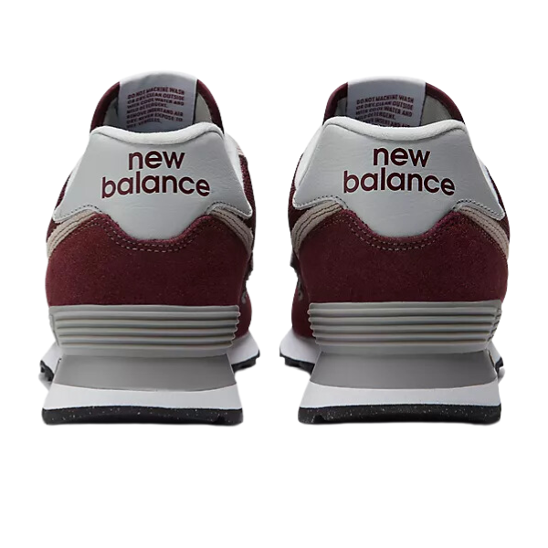 Two NEW BALANCE Mens 574 Magenta running shoes are shown from the back, featuring the bold brand name on white heel panels—ideal for those seeking both style and comfort.