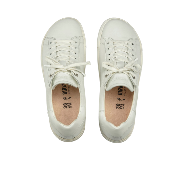 A pair of Birkenstock Mens Bend Low White sneakers, made from natural leather, is shown from above on a white background. Tan insoles display BIRKENSTOCK support details with size and brand info near the heels.