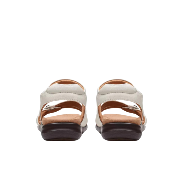 Back view of the Clarks Womens Wide Kitly Ave White sandal by CLARKS, featuring adjustable straps and brown soles with a Contour Cushion footbed, shown against a white background.