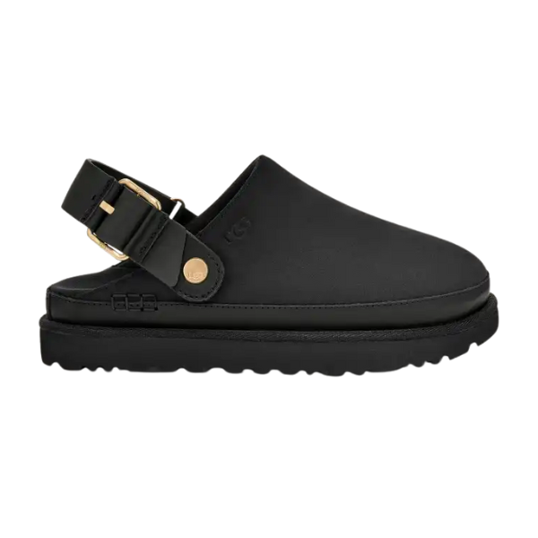 The UGG Women's Goldenstar Villa Black is a modern, minimalist slip-on sandal in nubuck leather with a closed toe, thick sole, and an adjustable backstrap with gold buckle and button—signature style from UGG.