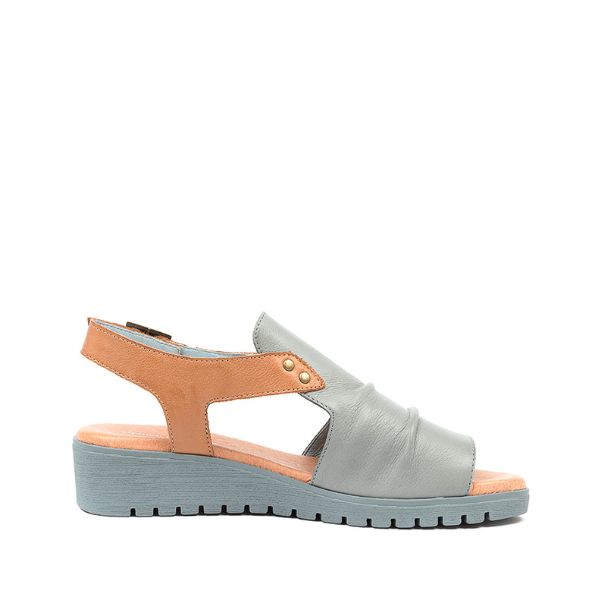 The Django & Juliette Womens Madis Steel Leather Gray/Tan sandal features a gray/tan leather upper, open toe design, low wedge heel, side cutouts, and small metallic studs for stylish comfort.
