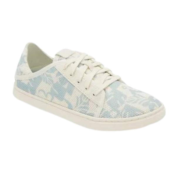 The OLUKAI Womens Pehuea Li Sneakers in Offwhite feature a light blue and white floral pattern, breathable mesh, white laces, and a white sole, shown on a white background.