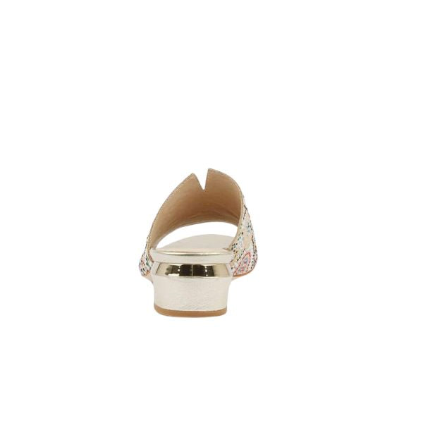 Back view of the Django & Juliette Womens Tammy Beige mule by DJANGO & JULIETTE, with a metallic gold low heel, open back, and patterned fabric sides; shown on a plain white background.