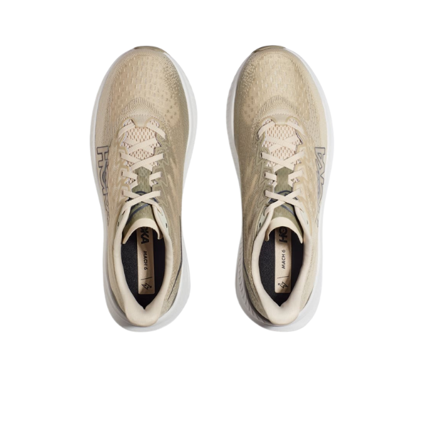 The HOKA Mens Mach 6 (Medium Width) in Beige/Oatmilk Barley, shown from above on a white background, highlights its laces, mesh uppers, and HOKA logo—ideal for everyday running and designed to help reduce foot pain.