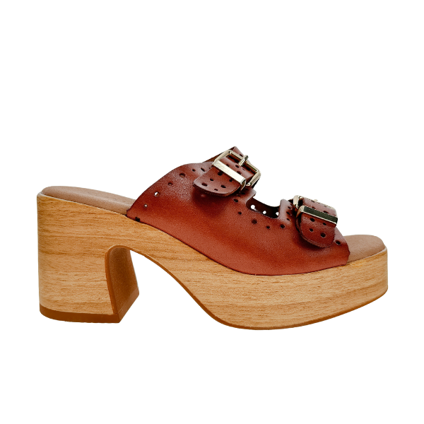 The SOVELLA Sovella Womens Paola Brown leather clog sandal features two buckle straps, a wooden platform sole, and a chunky block heel with cut-out design—supportive comfort for all-day wear.