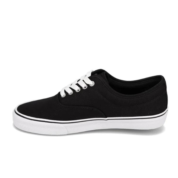 The Rival Mens Trips Black/White by RIVAL, INC. is a black low-top canvas sneaker with white laces, a white rubber sole, and a black edge stripe—classic CVO style ideal for mens trips or everyday wear.