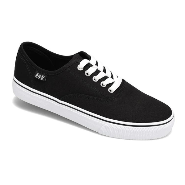The Rival Womens Trips Black/White by RIVAL, INC. is a black canvas sneaker with white laces and a white rubber sole, featuring a small logo tag and a Rival+ footbed for extra comfort.