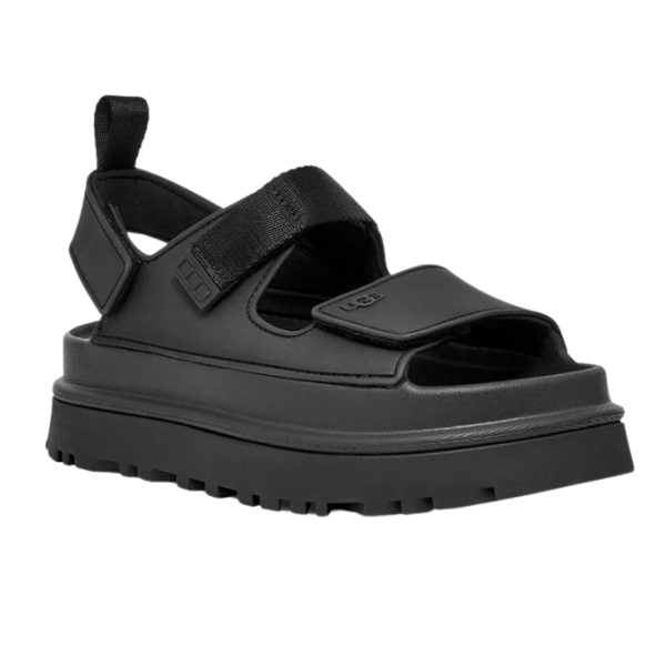 The UGG Womens Goldenglow Sandals in black feature an open-toe, chunky platform design with adjustable Velcro straps, thick treaded sole, and a heel pull tab—modern, comfortable sandals ideal for everyday wear.