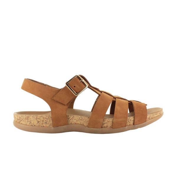 The Strive Womens Cristal Tan Leather sandal by STRIVE features a cork-textured sole, adjustable ankle strap with metal buckle, flat rubber outsole, and cushioned memory foam footbed for all-day comfort.