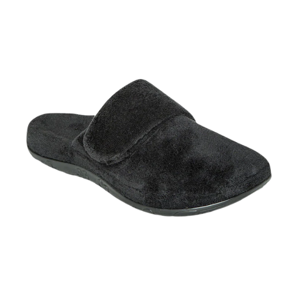 The Aetrex Women's Mandy Black slipper features arch support and a flat sole, shown side view on a white background.
