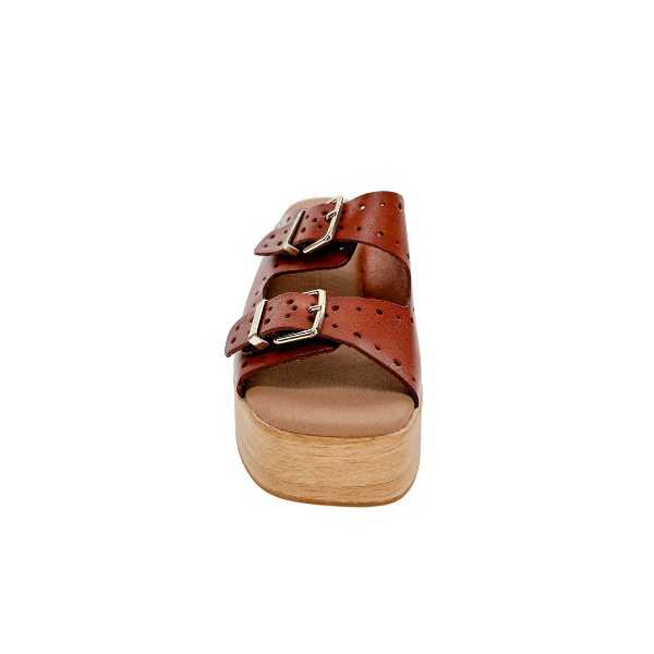 The SOVELLA Womens Paola Brown sandal features two adjustable buckle straps and a light-toned wooden platform sole, providing a supportive footbed for all-day comfort. Shown from the front on a white background.