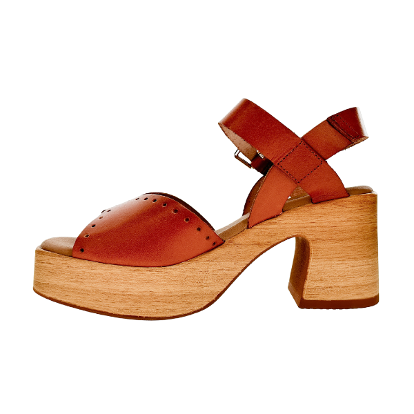 The SOVELLA Sovella Womens Lucia Tan sandal features a brown leather upper, open toe, ankle strap, supportive footbed, and a chunky wooden platform heel, shown in a side view against a white background.