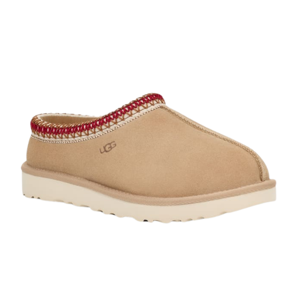 The UGG Womens Tasman Slipper in Sand/Dark Cherry features suede uppers, a thick light-colored sole, red decorative stitching at the ankle, and an open-back mule design for comfort and style.