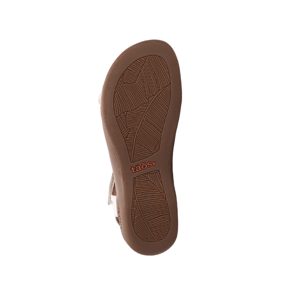 The sole of a black Taos Womens Show Stopper sandal features textured patterns and the “TAOS” brand name in orange near the heel, designed for foot pain relief, shown against a white background.