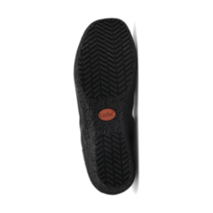 The image shows the black rubber sole of the Taos Womens Chit Chat Black flat by TAOS, featuring a herringbone tread pattern, Arch & Metatarsal Support, and a small round brown logo near the center.