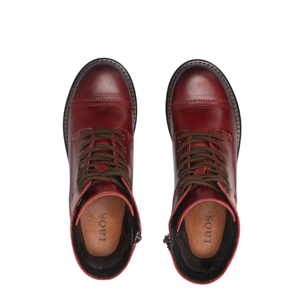 Top view of Taos Womens Crave Boot Red: red leather lace-up boots with brown laces, tan insoles, and TAOS branding inside, designed for women with excellent arch support and comfort.