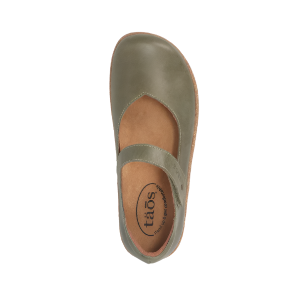 Top view of a single TAOS Womens Ultimate Forest Mary Jane shoe in olive green with arch support, an instep strap, and the TAOS brand name visible on the insole.