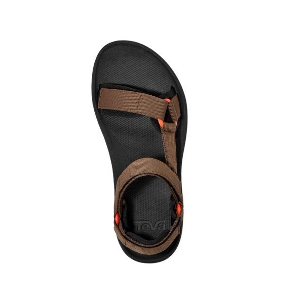 A Teva Mens Hydratrek Sandal in brown, featuring adjustable straps and orange accents, made from recycled materials, is seen from above against a white background.