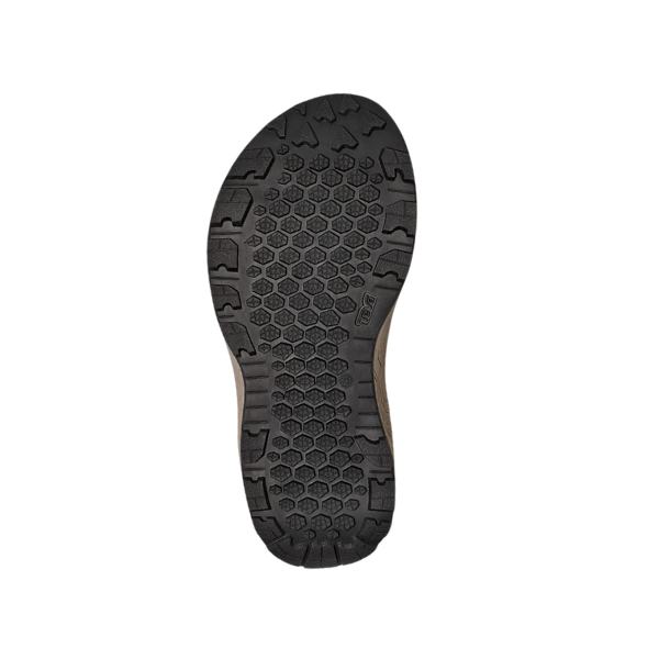 The Teva Womens Hydratrek Sandal White/Taupe features a black rubber sole with hexagonal tread and grooves, highlighting advanced traction technology. The sole is shown from the bottom against a white background.
