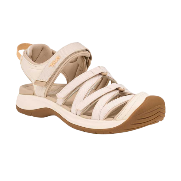 The Teva Womens Tirra CT Birch sandal by Teva features a beige and tan design, thick contoured sole, Velcro closures, and recycled polyester construction—ideal for outdoor or casual wear.