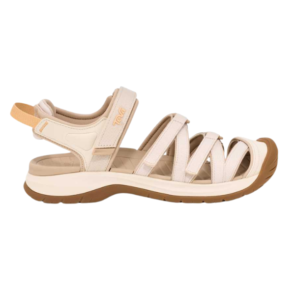 The Teva Womens Tirra CT Birch sandal features beige and brown fabric straps, a closed heel, open toe, and thick sole. With an adjustable Velcro ankle strap and recycled polyester construction, it’s ideal for outdoor adventures.