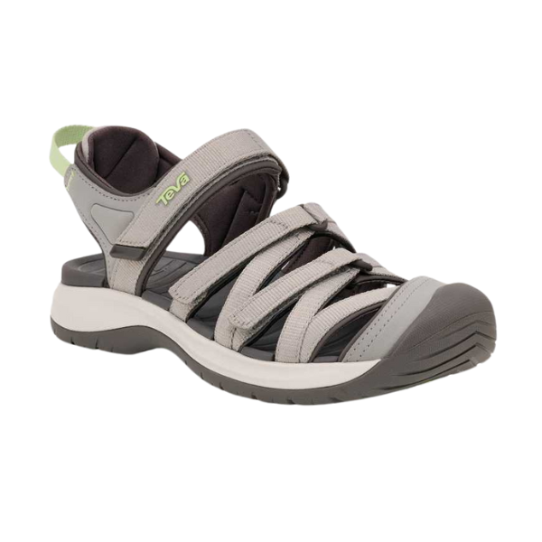 The Teva Womens Tirra CT Grey is a gray and black sandal with adjustable straps, closed toe, rugged sole, arch support, heel strap with green loop, recycled materials, and the Teva logo on one strap.
