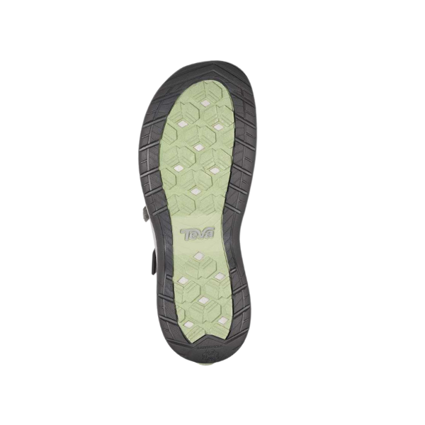 The Teva Womens Tirra CT Grey sandal has a light green sole with a black-edged hexagonal tread, arch support for comfort, and the Teva logo centered on the bottom.