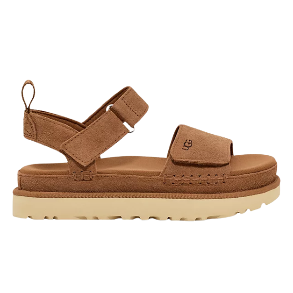 The UGG Womens Goldenstar Chestnut is a brown suede platform sandal with a thick beige sole, open toe, adjustable ankle strap, visible stitching, and an embossed UGG logo on the Wide front strap.