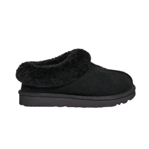 The UGG Women’s Tazzette Slipper in Black features a slip-on design, plush sheepskin lining around the opening, a low heel, and a sturdy, lightweight sole for cozy indoor comfort or light outdoor wear.