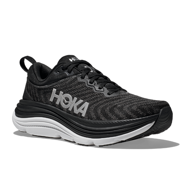 The HOKA Mens Gaviota 5 Wide in Black/White features a thick white sole, black laces, white HOKA logo, and Stabilizing H-Frame technology, shown against a plain white background.