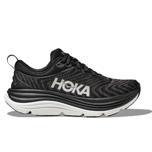 The HOKA Mens Gaviota 5 Wide in Black/White features a thick white sole, black Creel jacquard mesh upper, and a bold white HOKA logo on the side. Displayed in profile on a plain white background.
