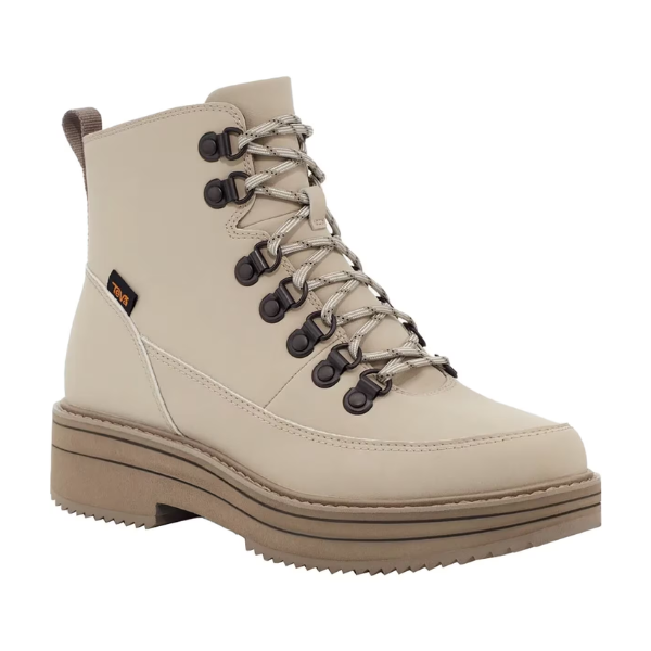 The Teva Womens Midform Boot in Feather Grey features a thick, two-tone brown sole, metal eyelets, visible stitching, and a small black and orange tag. This stylish ankle boot offers comfort for foot pain with a modern, rugged design by Teva.